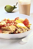 Muesli with pear and pink grapefruit