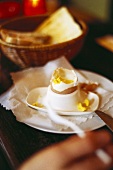 Boiled egg in a white eggcup