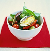Roasted vegetables with capers in white bowl