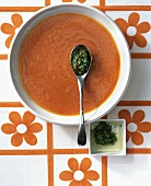 Cold carrot soup with herb and chili salsa