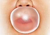 Bubble gum bubble in front of someone's face