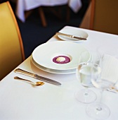 Table laid in white with soup