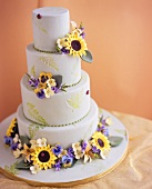 Multi-tiered marzipan cake with flower decoration
