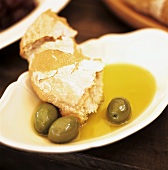 White bread with olives and olive oil