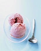 Two scoops of strawberry ice cream
