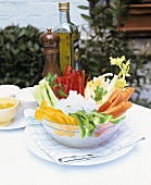 Crudités in glass bowl with various dips
