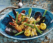 Mixed seafood with potatoes, cooked in wok