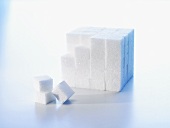 Sugar cubes, partly piled up in a block