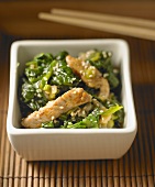 Strips of pork with spinach and sesame
