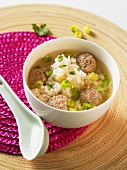 Chinese rice soup with meatballs