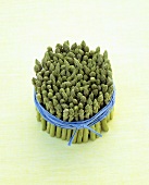 Green asparagus with blue string