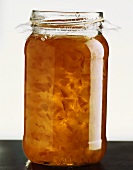 Orange marmalade in a jam jar