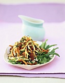 Rice salad with fried vegetables and rocket