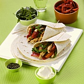Wraps with meat, pepper and rocket