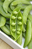 Pea pods, one open