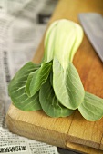Pak choi on a wooden board
