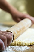 Rolling out pastry with rolling pin