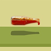 A flying tomato ketchup bottle