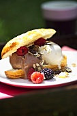 Brioche with ice cream and berries