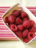 Fresh raspberries in a punnet