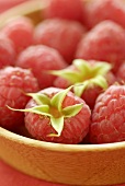 Fresh raspberries in a wooden bowl