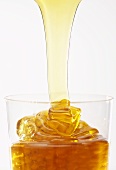 Honey running into a glass