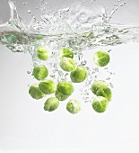 Brussels sprouts falling into water
