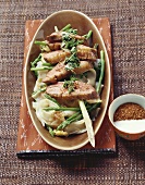 Duck breast on rice noodles with green asparagus