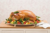 Stuffed roast turkey with vegetables and herbs