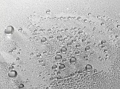 Drops of water on grey surface