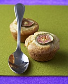 Two fig muffins with spoon