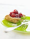 Raspberries in puff pastry with icing sugar