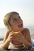 Happy, young girl on the beach