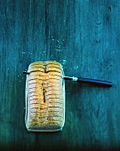 A sliced loaf of bread with knife
