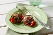 Bacon-wrapped stuffed pepper wedges