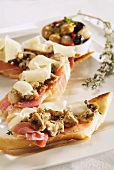 Parma ham, mushrooms and cheese on toasted bread