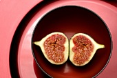 A halved fig in a dish
