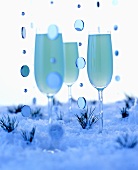 Blue winter drinks in artificial snow