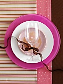 Pink place-setting with wine glass