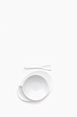 White cup, saucer and spoon
