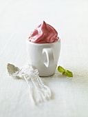 Raspberry ice cream in a cup