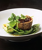 Grilled tuna fillet with soy dressing on salad