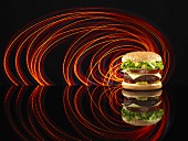 A cheeseburger in an arch of coloured lights
