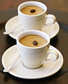 Coffee cream with coffee bean in cups and saucers