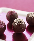 Four chocolates with dragées