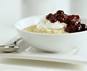 Porridge with cream yoghurt and red fruit compote