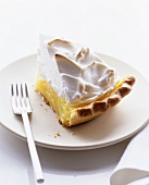 A piece of lemon meringue tart