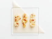 Three shrimp skewers with chilli