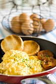 Scrambled egg with tomatoes and toasted bread