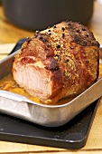 Glazed ham in roasting tin